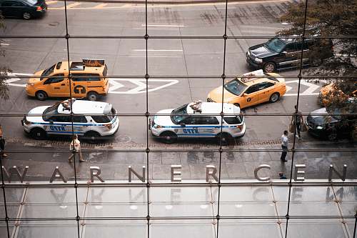 taxi two parked NYPD vehicles car